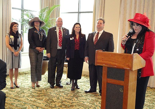 Andrew Bell of Watson Realty will be this year's president of the Jacksonville chapter of the Women's Council of Realtors. Audrey Lackie (right) of Watson Realty installed the officers during the annual meeting last month at San Jose Country Club: (fr...