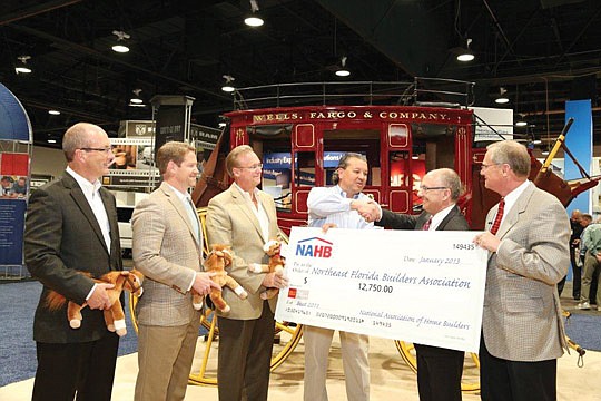 Davis, Linder and Ginder (from left) with NAHB officials.