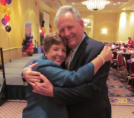 Realtor of Year Holly McMurry of The Legends of Real Estate and NEFAR  executive Glenn East.