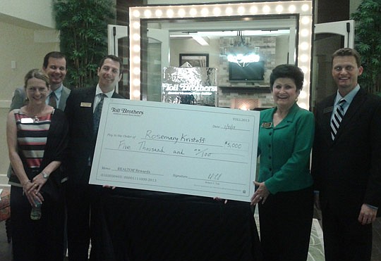 Rosemary Kristoff of the Prudential Network Realty (second from right) won the $5,000 grand prize and showed off her check to (from left) Kelly Hofelt, Steve Merten, Greg Netro and Andrew Colavito.