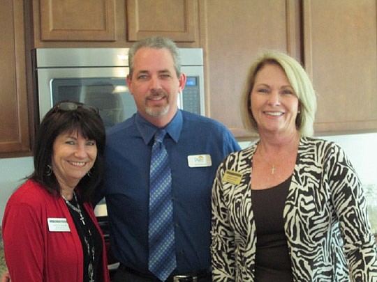 Pulte Homes opened a model last month at Forest Hammock at OakLeaf Plantation in Orange Park. Jeff Nickerson of Pulte Homes is with Kim Coughlin (left) and Sharon Wyatt of East West Realty.