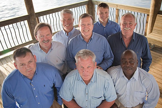 The New Leaf Construction team of (from left, front to back) Stacey Jaques, Paul Sturney, Sam Stewart, Scott Blunck, Lee Arsenault, Ed Arnold, Doug Maier, Brandon Faulkner