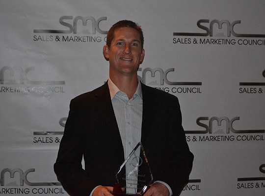 Justin Robbins with CornerStone's award