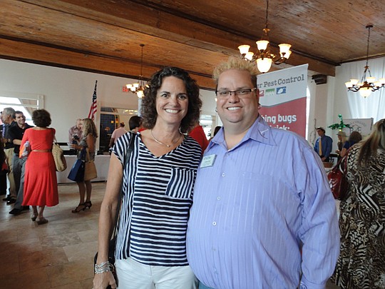 Northeast Florida Association of Realtor president Carol Zingone with Jacksonville Women's Council of Realtors president Andrew Bell.