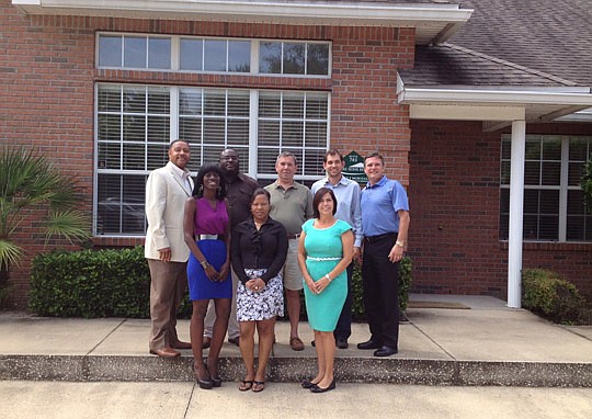 The office: (back row) Ike Scott, Corey Rose, Wes Dumas, Kevin Hicks and Bob McDugald, and (front row) Avanta Williams, Tameka Britton and Carolyn Lovelady