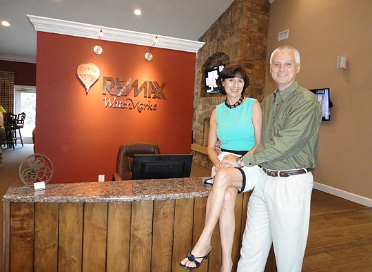 Debby Leahy and Len Cook of Re/Max Watermarke welcomed people to the event and sold raffle tickets to benefit The Children's Miracle Network.