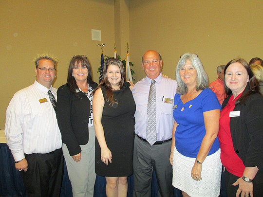 Andrew Bell, the current WCR president from Watson Realty; Audrey Lackie, Erica Richie and Marc Jernigan, Watson Realty; Diane Cook, Exit Real Estate Gallery; and Bobbie Harper, Total Title Solutions.