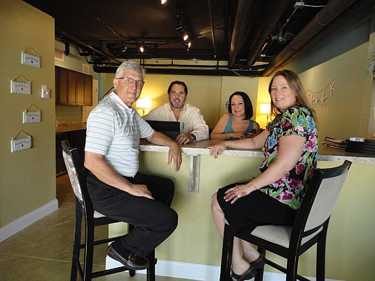Brokers Steve Calta (left) and Rose Hetman-Clemente (right) with agents Rick Filippone and Otelia Teate.