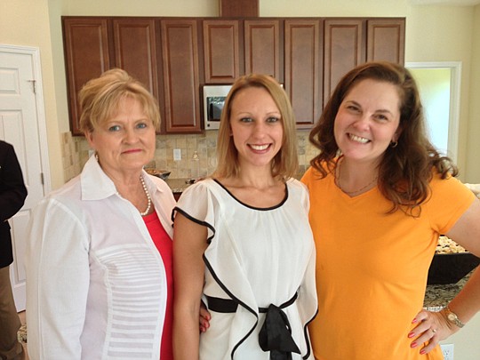Landon Homes held a grand opening for Realtors to see the company's new model in the Mandarin subdivision of Summerton Oaks last month. Landon representatives (from left) Kay  Hall, Nicole Smagala and Marnee Oehmann welcomed guests.