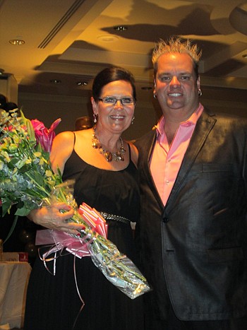 The Jacksonville chapter of the Women's Council of Realtors held its annual fashion show last month at the Marriott Southpoint and chairman Missi Howell was presented flowers from chapter President Andrew Bell of Watson Realty.