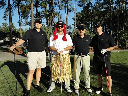 Andrew Riley of EverBank gave one for the team (the other three are Allen Lewis, Mike Hendrickson and David Mordecai) and that's why he's in this unmanly outfit.