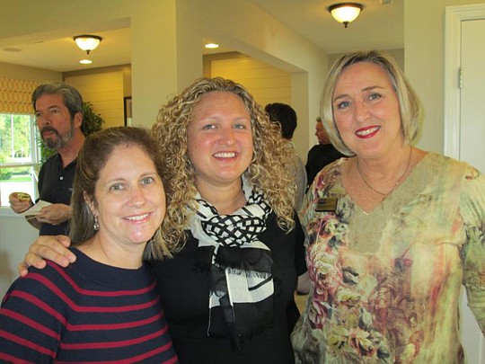 There was a large turnout last month for David Weekley Homes' grand opening event at the Durbin Crossing Village Center. Tracy Provenzano and Denise Patricolo from the host company greeted Gwen Wittington of Coldwell Banker.