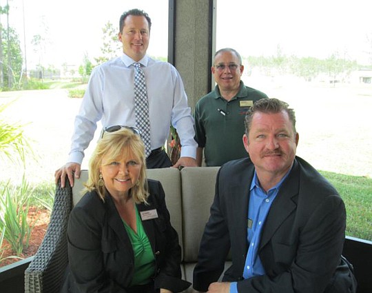 Chris Breccia and Daryl GilbertÂ (standing) and Lauren Eastman and Tom Cavanaugh,Â all of D.R. Horton.