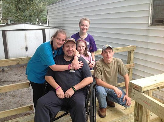 Kathy, Billy, Samantha, Tabitha and Aaron Land enjoy the freedom and mobility a wheelchair ramp provides.
