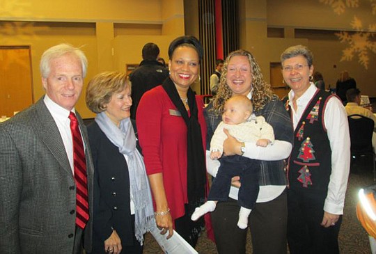 Outgoing chairman Jim Doyle of RedDot Marketing was joined by Mirtha Barzaga, Davidson Realty,  Katrina Watkins of Emerald Homes, who chaired the auction; past SMC chairman Denise Patricolo of David Weekley Homes with her son, and Sherry Davidson, Dav...