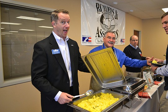NEFBA's executive committee practices serving the association. Serving up breakfast at the December board meeting are (from left) 2014 President Daniel Blanchard, Third Vice President Larry Wittmer and First Vice President Rick Morales.