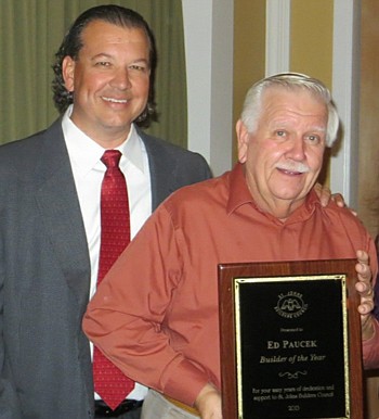 Ed Paucek (right), of The Blackstar Group, was named St. Johns Builders Council's Builder of the Year. Presenting the award was Dennis Ginder, NEFBA 2013 president and member of the SJBC.