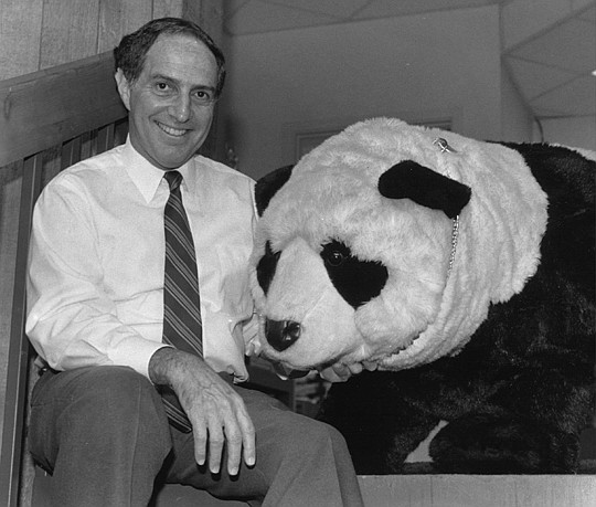 Do you recognize this young executive director posing with one of the association's Spike award winners? That's right. Arnold Tritt and Bill Ding.