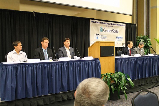 Five real estate experts discussed the industry's future at the Northeast Florida Real Estate Symposium, held last month at the University of North Florida. From left are residential homebuilder Greg Matovina, Jacksonville city planning and engineerin...