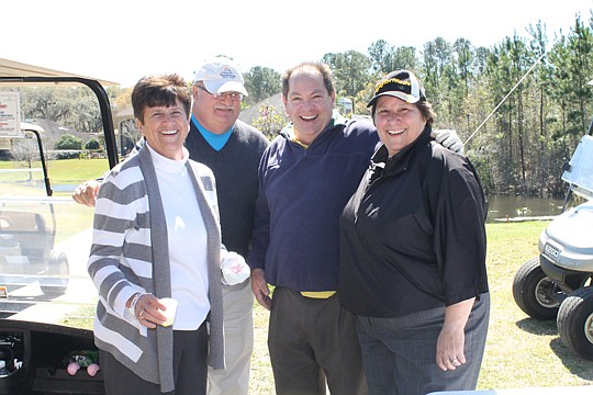 The Legends of Real Estate team spent equal time golfing and laughing at the March 13 event at the Orange Park Country Club. From left, Realtors Sheryl DeGrove, Brad Manor, Steve Kanyar and Millie Kanyar.