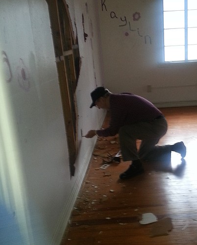 A volunteer from Holy Trinity Anglican Church helps with the electrical work at the church, where Builders Care is helping create a community center.