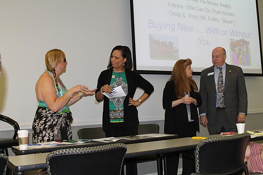 Realtor Liz McMahan, site agent Katrina Watkins, and "home buyers" Rory Durbin and Cindy Foley dramatize the wrong way to manage the broker-builder relationship in a skit called "Buying New - With or Without You."