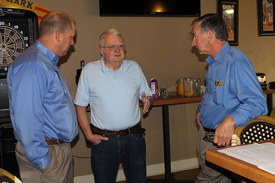 Clay County Building Department official David Conner, builder John Cogdill and Clay Parks and Recreation director Jeff Boyer talk before breakfast.