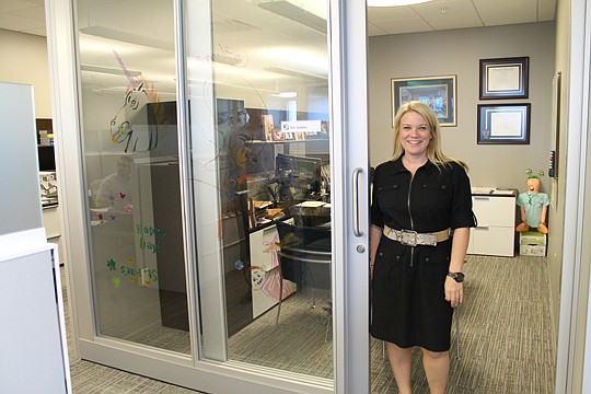 Teri Sowder, tax senior manager for Dixon Hughes Goodman, emerges from her office to chat. Executive offices have glass fronts with sliding glass doors. "The staff can see us at work," Windley said. "It's created a connectedness between the staff and ...