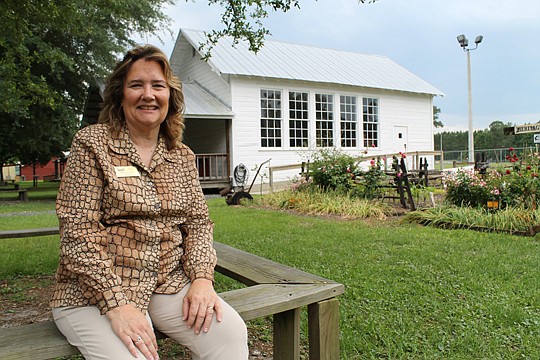 Beth Clark, a Realtor for Coldwell Banker, shows off Clay County's assets with a trip to the Early Florida Village at the county fairgrounds. The outdoor living history museum includes pioneer homes and shops transported from their original locations....