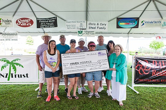 From left are Mike Oglesbee, OGS Tournament Trails; NEFAR staffer Savannah Bell; NEFAR member Marc Spalding; Haven Hospice staffer Deborah Strickland; Haven Hospice staffer Becky Slobodian; Haven Hospice staffer Courtney Quirie; NEFAR CEO Glenn East; ...