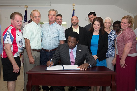 After years without city water, many residents of the Larsen neighborhood will soon have safe, reliable source. In a bill-signing ceremony Saturday at the neighborhood just south of Downtown, Mayor Alvin Brown officially put his name to paper approvin...