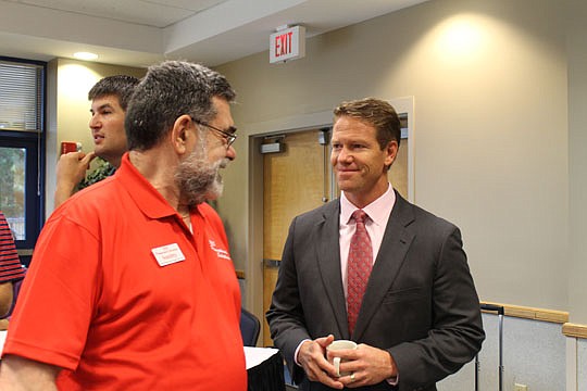 Randall Smith of SBS promotional Solutions with JAX Chamber President and CEO Daniel Davis (right) at NEFBA's Sales and Marketing Council meeting in August.