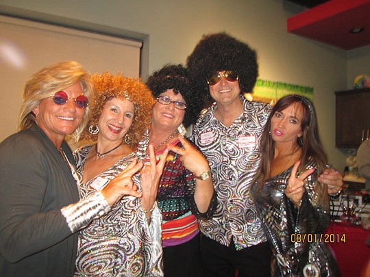 Re/Max WaterMarke went retro to raise money for The Children's Miracle Network last month. The company held an Energy's Rising Realtor Disco Party, complete with disco dancing and a costume contest. At left are Carla Ferrari, Tami Glover, Anita Hiles,...