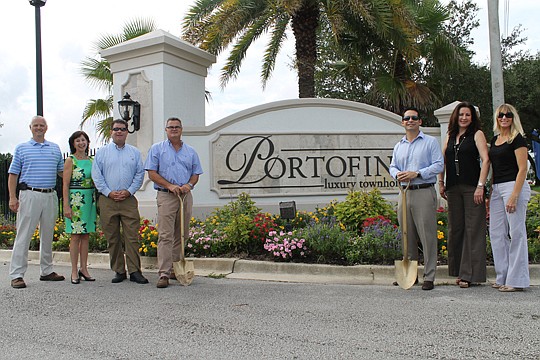 From left are John and Tami Glover, owners of Re/Max WaterMarke, sales agent for the project; John Faiella of Atlantic Coast Bank; Ronnie Leinwohl and Edmundo Gonzalez of Urban Partners Construction; and Michelle Mousin and Melanie Escalante, Re/Max W...