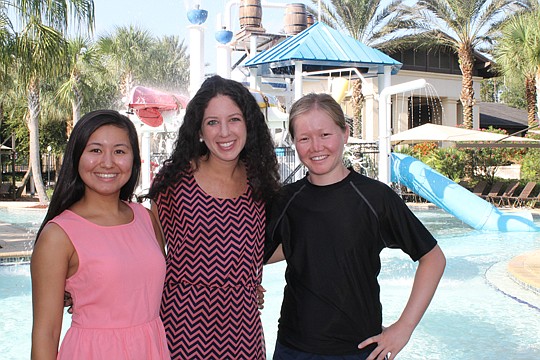 Kelly Ray (center), director of marketing for The PARC Group, invited two students from Kazakhstan - Aisulu Ispayeva (left) and Aigul Zhumasheva - to teach summer camp in Nocatee this year. In 2012, Ray taught English in the girls' hometown of Almaty.