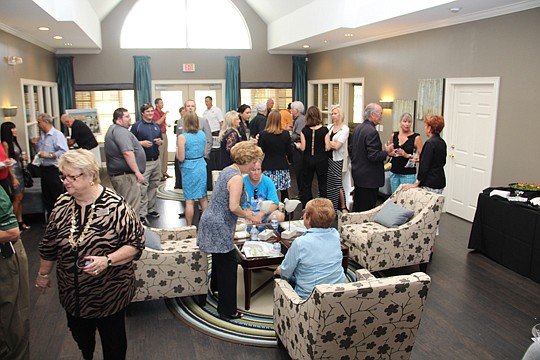 WGV Residential Ventures 1 broke ground in September on La Fontana, a 52-unit condo development that will complete The Residences at World Golf Village. A reception (above) followed the ceremony.