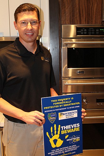 Providence Homes will start marking its building materials and appliances with SmartWater, a permanent liquid that is forensically coded to identify the owner. Charles Roberts, vice president of Operations for Providence Homes, said warning signs will...