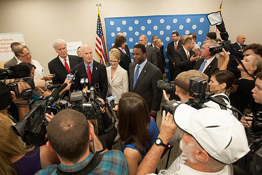 Gov. Rick Scott answers questions about GE Oil &amp; Gas selecting Jacksonville for a 500-job manufacturing plant. Also pictured are U.S. Rep. Ander Crenshaw; Julie DeWane, Â vice president, Global Supply Chain atÂ GEÂ Measurement and Control; and May...
