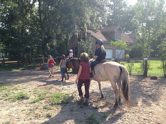 A horse's gait is used in therapy for patients with neurological or other disabilities at Horse Sense and Sensitivity.