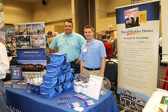 Ben Cashen and Jonathan Gripp, both of David Weekley Homes, worked a booth at University of North Florida's October jobs fair for the College of Computing Engineering and Construction. Other homebuilders in attendance were D.R. Horton, Lennar Homes, D...