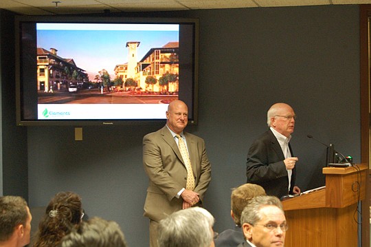 Peter Rummell talks about "Healthy Town" during his presentation to the JEA board last month. Rummell is partnering with Mike Balanky (left) on the project. The team's development, Elements, was selected by the board to develop the former Southside Ge...