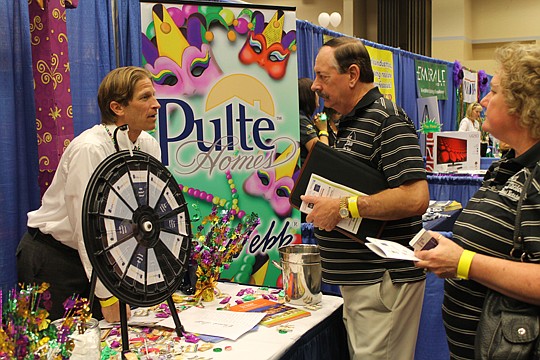 Ian Kanady of Pulte Homes pitches his company's homes to Realtors from 1st Choice Real Estate at the annual Realtor-Builder Trade Show.