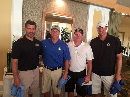 Winning team members are Michael BourrÃ©, Andy Chambers, Scott Burney and Jeff Knauff.