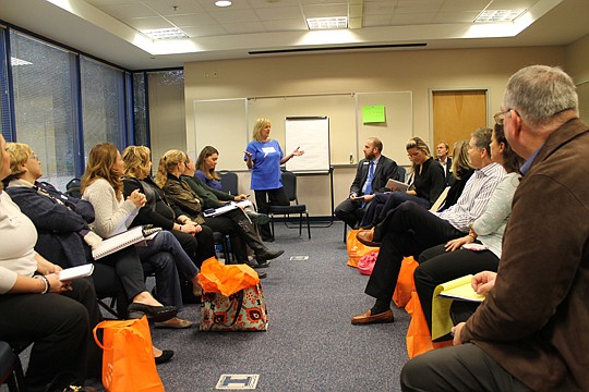 Kim Knapp of Coldwell Banker Vanguard Realty leads a session on how "Creating Raving Fans." Methods that Realtors use include mailing a page of Christmas-themed address labels, sending a Starbucks gift card and emailing a reminder to file for homestea...