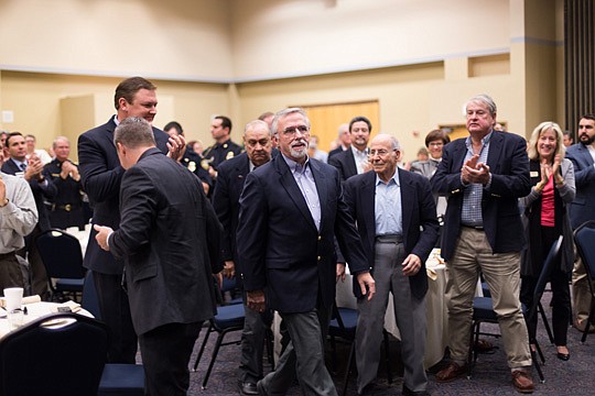 Don Wilford (center) walks forward to accept the NEFBA Builder Member of the Year on behalf of ICI Homes. Wilford is the division president of ICI and was Builder Member of the Year in 2006.