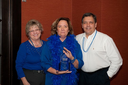 Beth Clark (center) was named Coldwell Banker Premier Properties World Golf Village's top listing agent, with more than $5 million in closed business in 2014. Clark also received Coldwell Banker's International Sterling Award at a February awards lunc...