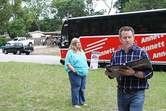 Cameron Gaskill leads 80 real estate investment students through rehab properties in Jacksonville as part of the Jacksonville Real Estate Investors Association's Boot Camp and Bus Tour. The course covers how to put together a rehab deal. Gaskill is a ...