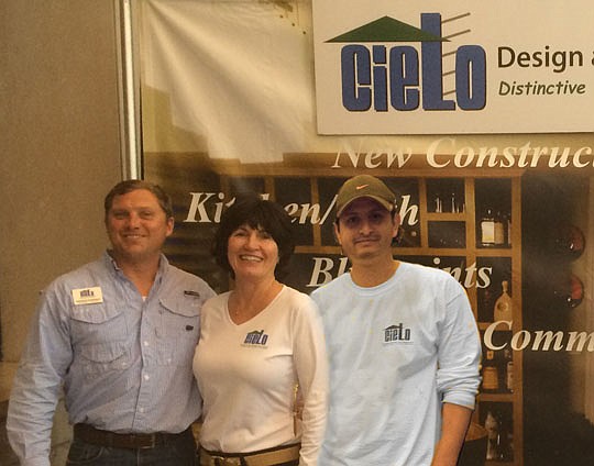 John Hockenberry, Kathleene Larriviere and Diego Villanueva of Cielo Design and Construction stand in front of their exhibit at the Fall Home &amp; Patio Show in 2014. The company was selected to create the front entrance to the show.
