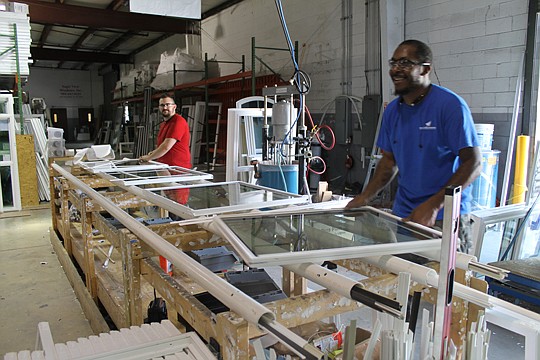 Eagle View Windows employees install window glass on frames and cover the edges with glazing beads, which serve as trim. The "snap-in-place" beads are removable, so glass can easily be replaced on a broken window.