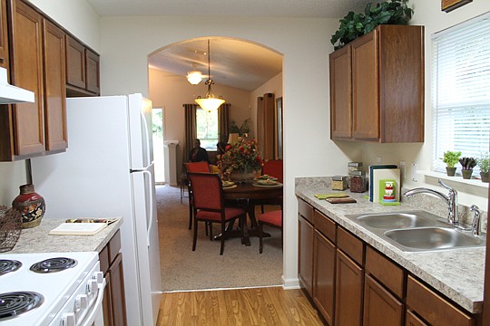 The Wiley, a 3-bedroom, 3-bathroom home, features a vaulted ceiling in the living/dining room and new Whirlpool appliances.